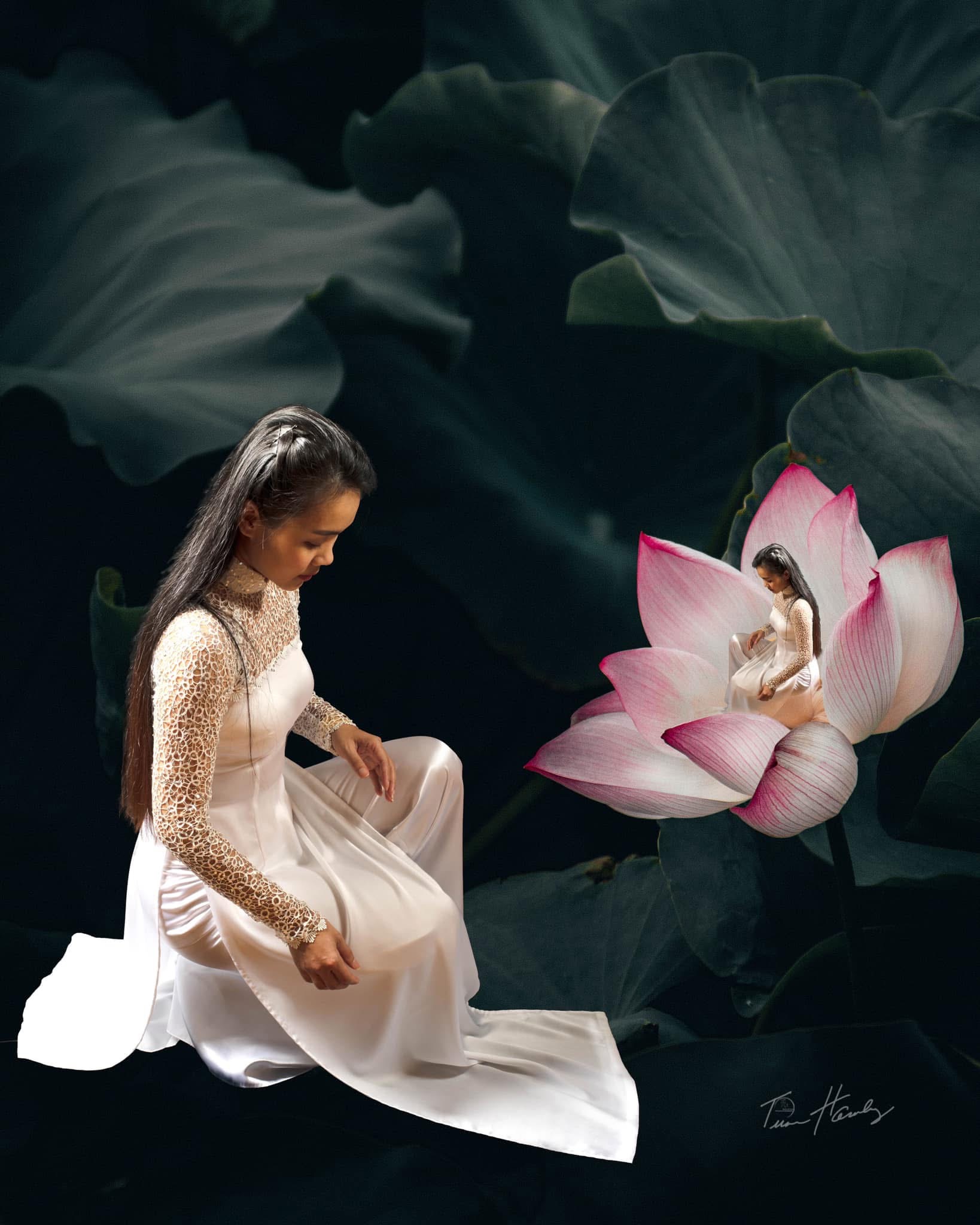 Woman in áo dài beside lotus with miniature version inside
