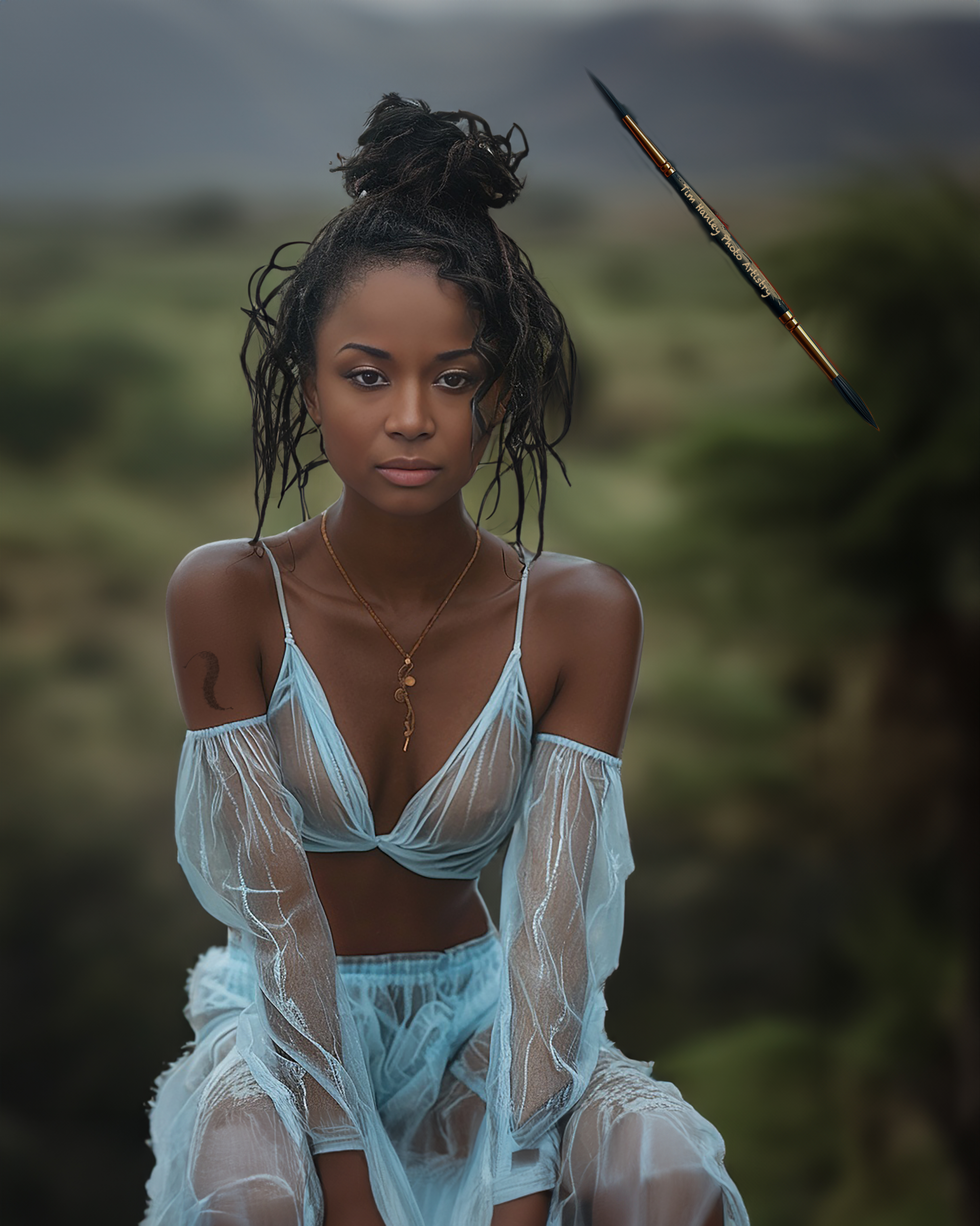 Woman in African landscape with floating branded paintbrush