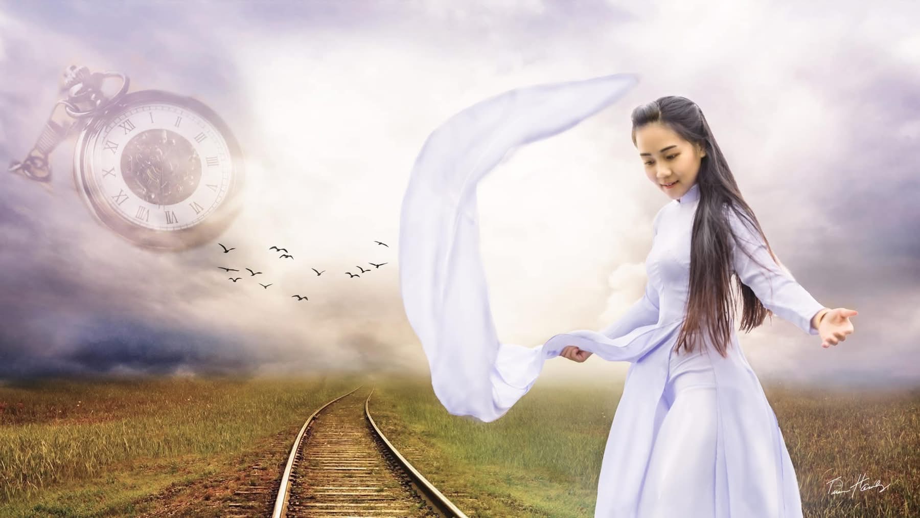 Woman in áo dài by railway with floating pocket watch