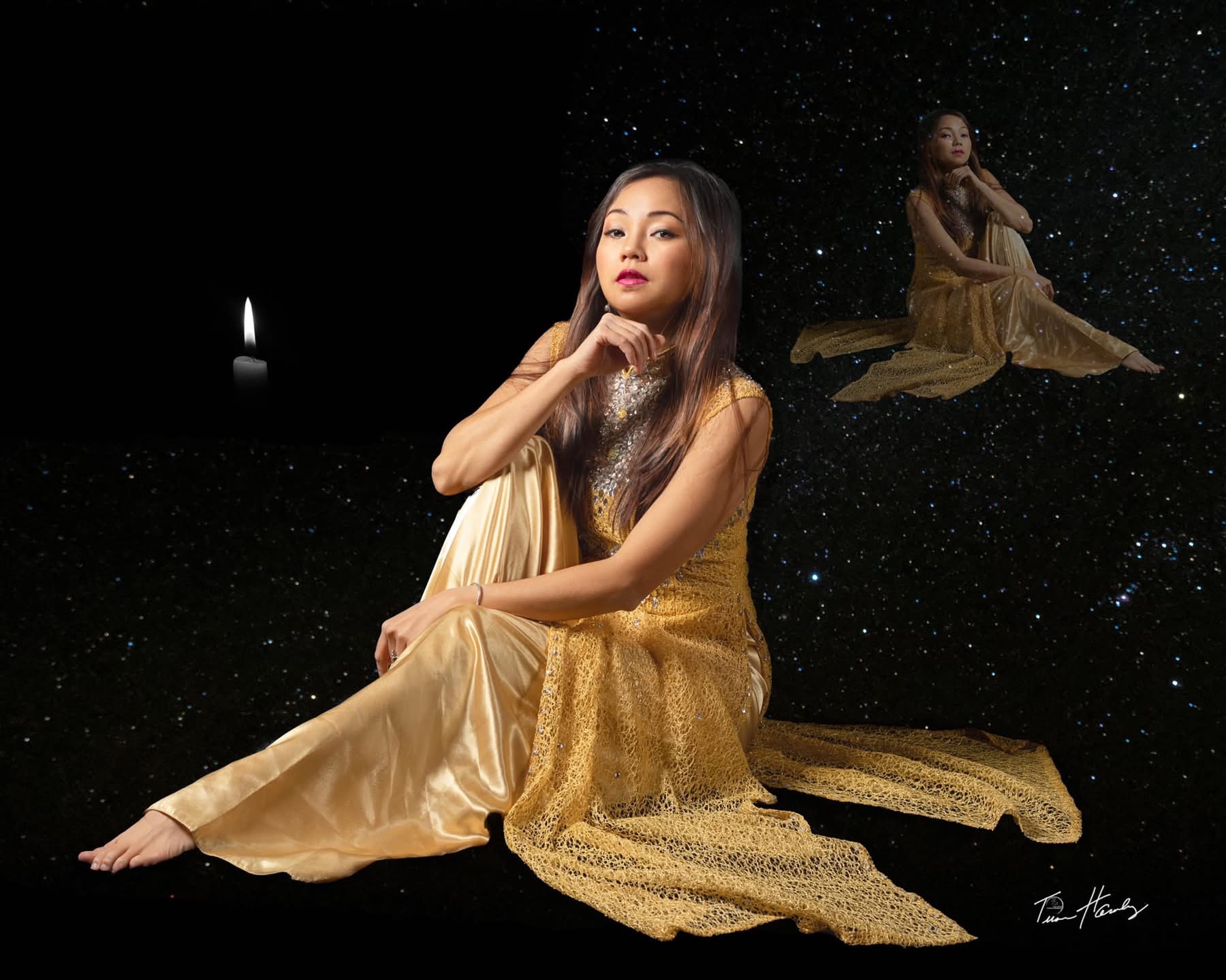 Woman in satin dress floating in starfield